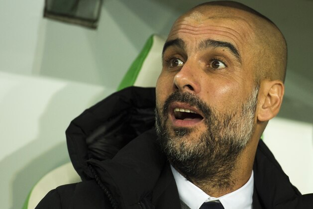 Bayern Munich's Spanish head coach Pep Guardiola watch proceedings during the German Cup DFB Pokal second round football match between VfL Wolfsburg vs FCB Bayern Munich in Wolfsburg, on October 27, 2015. AFP PHOTO / ODD ANDERSEN

RESTRICTIONS / EMBARGO  ACCORDING TO DFB RULES IMAGE SEQUENCES TO SIMULATE VIDEO IS NOT ALLOWED DURING MATCH TIME. MOBILE (MMS) USE IS NOT ALLOWED DURING AND FOR FURTHER TWO HOURS AFTER THE MATCH. FOR MORE INFORMATION CONTACT DFB DIRECTLY AT +49 69 67880.        (Photo credit should read ODD ANDERSEN/AFP/Getty Images)