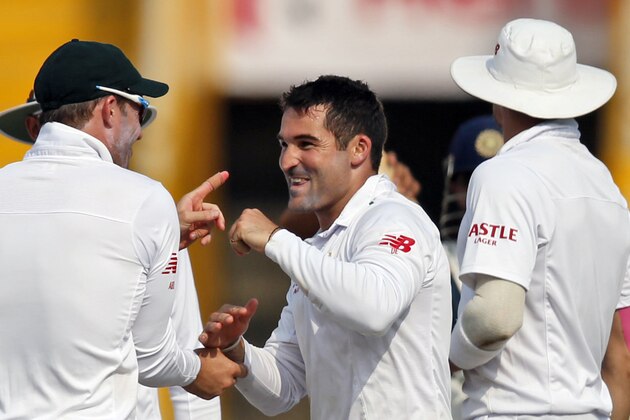 South Africa's Dean Elgar, center, celebrates the dismissal of India's Amit Mishra during the first day of their first cricket test match in Mohali, India, Thursday, Nov. 5, 2015. (AP Photo /Tsering Topgyal)