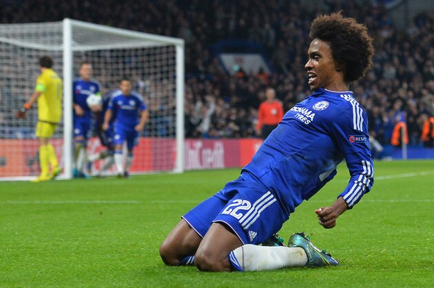 Chelsea's Brazilian midfielder Willian (R) celebrates after scoring from a free kick during a UEFA Chamions league group stage football match between Chelsea and Dynamo Kiev at Stamford Bridge stadium in west London on November 4, 2015.  AFP PHOTO / GLYN KIRK        (Photo credit should read GLYN KIRK/AFP/Getty Images)