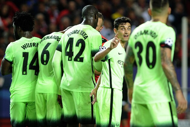 Manchester City's Spanish midfielder Jesus Navas (2R) gestures during the UEFA Champions League football match Sevilla FC vs Manchester City at the Ramon Sanchez Pizjuan stadium in Sevilla on November 3, 2015.  AFP PHOTO / CRISTINA QUICLER        (Photo credit should read CRISTINA QUICLER/AFP/Getty Images)