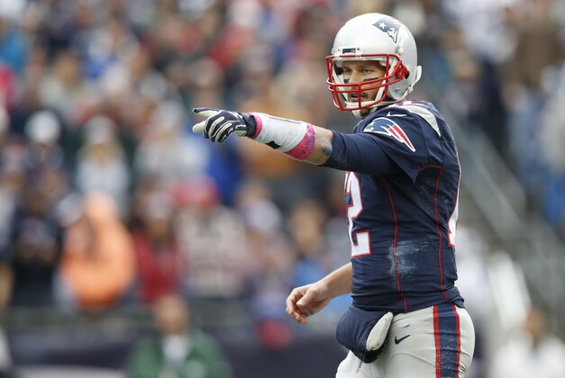 Oct 25, 2015; Foxborough, MA, USA;  New England Patriots quarterback Tom Brady (12) makes an adjustment at the line of scrimmage during the third quarter against the New York Jets at Gillette Stadium.  The New England Patriots won 30-23. Mandatory Credit: Greg M. Cooper-USA TODAY Sports