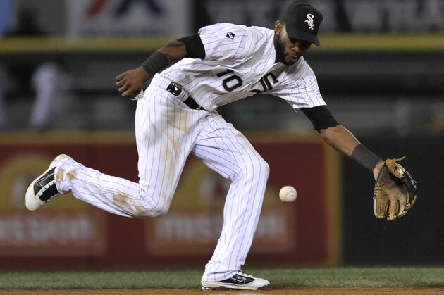 Chicago White Sox shortstop Alexei Ramirez stops a grounder hit by Oakland Athletics' Josh Donaldson during the eighth inning of a baseball game in Chicago, Wednesday, Sept. 10, 2014. Donaldson was out at first. Chicago won 2-1. (AP Photo/Paul Beaty)