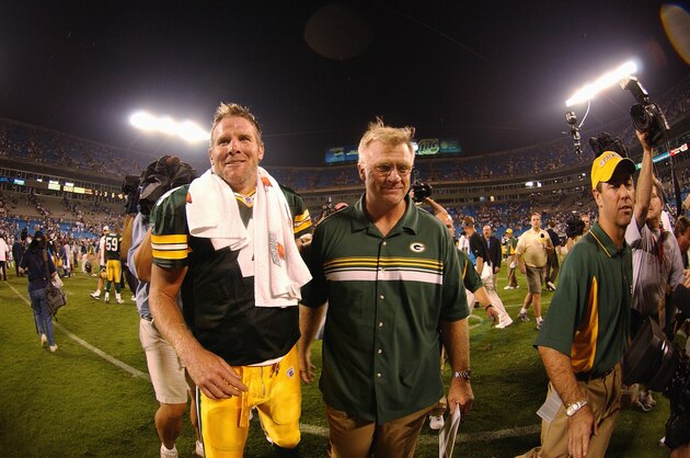CHARLOTTE, NC - SEPTEMBER 13:  Brett Favre and heqad coach Mike Sherman of the Green Bay Packers smile as they walk off the field after the game against the Carolina Panthers on September 13, 2004 at Bank of America Stadium in Charlotte, North Carolina.  The Packers won 24-14.  (Photo by Scott Cunningham/Getty Images)