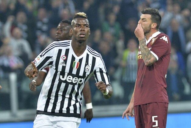 Juventus' Paul Pogba celebrates after scoring during a Serie A soccer match between Juventus and Torino at the Juventus stadium, in Turin, Italy, Saturday, Oct. 31, 2015. (AP Photo/ Massimo Pinca)
