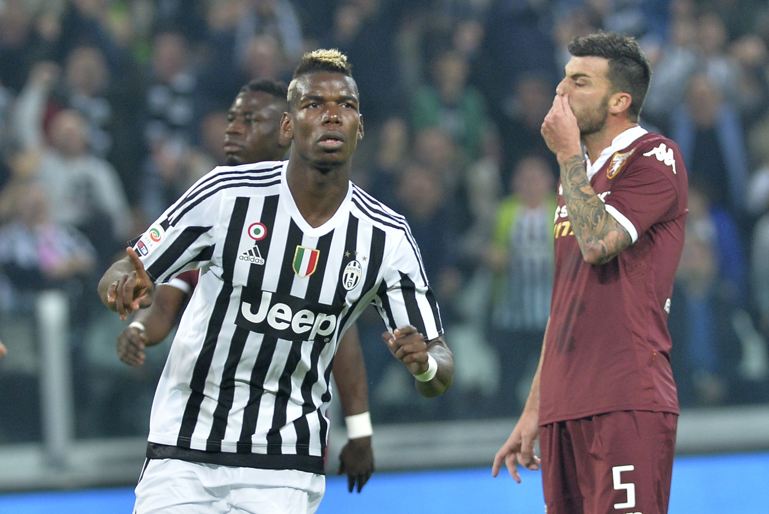 Juventus' Paul Pogba celebrates after scoring during a Serie A soccer match between Juventus and Torino at the Juventus stadium, in Turin, Italy, Saturday, Oct. 31, 2015. (AP Photo/ Massimo Pinca)