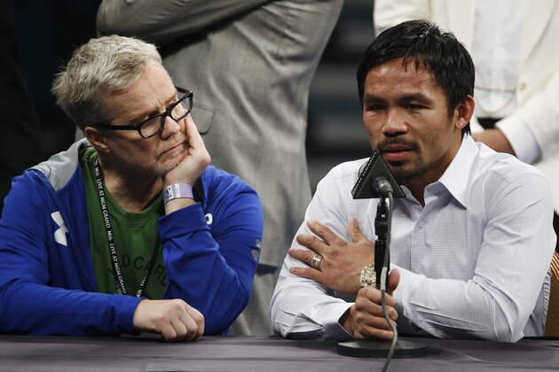 FILE - In this May 2, 2015 photo, trainer Freddie Roach, left, listens as Manny Pacquiao answers questions during a press conference following his welterweight title fight against Floyd Mayweather Jr. in Las Vegas. Pacquiao could face disciplinary action from Nevada boxing officials for failing to disclose a shoulder injury before the fight. Nevada Athletic Commission Chairman Francisco Aguilar said that the state attorney general’s office will look at why Pacquiao checked “no” a day before the fight on a commission questionnaire asking if he had a shoulder injury. (AP Photo/John Locher) FILE - In this May 2, 2015 photo, trainer Freddie Roach, left, listens as Manny Pacquiao answers questions during a press conference following his welterweight title fight against Floyd Mayweather Jr. in Las Vegas. Pacquiao could face disciplinary action from Nevada boxing officials for failing to disclose a shoulder injury before the fight. Nevada Athletic Commission Chairman Francisco Aguilar said that the state attorney general’s office will look at why Pacquiao checked “no” a day before the fight on a commission questionnaire asking if he had a shoulder injury. (AP Photo/John Locher)