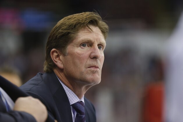 Toronto Maple Leafs head coach Mike Babcock watches from the bench against the Detroit Red Wings in the first period of a NHL hockey game in Detroit Friday, Oct. 2, 2015. (AP Photo/Paul Sancya)