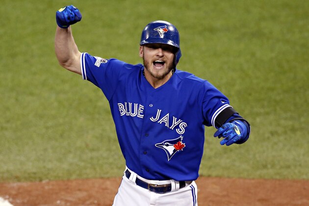 Toronto Blue Jays' Josh Donaldson celebrates his two run home run against the Kansas City Royals during the third inning in Game 3 of baseball's American League Championship Series on Monday, Oct. 19, 2015, in Toronto. (AP Photo/Paul Sancya)