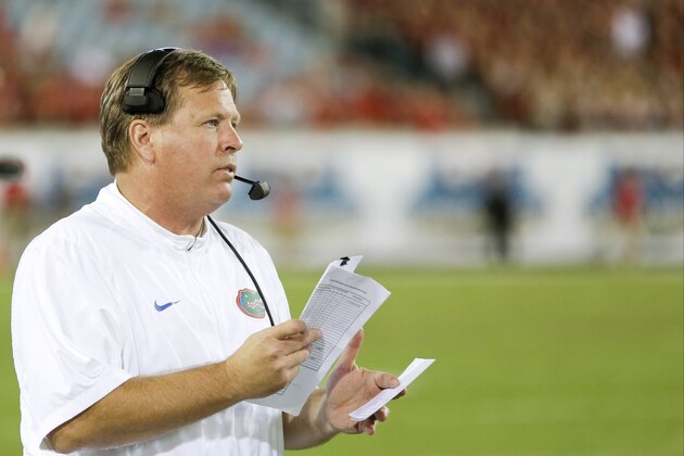 Florida head coach Jim McElwain watches his team compete against Georgia during the during the second half of an NCAA college football game, Saturday, Oct. 31, 2015, in Jacksonville, Fla.  Florida won 27-3. (AP Photo/John Raoux)