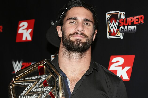 IMAGE DISTRIBUTED FOR 2K - WWE World Heavyweight Champion Seth Rollins poses with his championship title at the WWE 2K SummerSlam Kickoff in New York, N.Y., on Thursday, Aug. 20, 2015. (Photo by Stuart Ramson/Invision for 2K/AP Images)