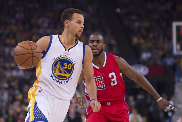November 4, 2015; Oakland, CA, USA; Golden State Warriors guard Stephen Curry (30) dribbles the basketball against Los Angeles Clippers guard Chris Paul (3) during the first quarter at Oracle Arena. Mandatory Credit: Kyle Terada-USA TODAY Sports