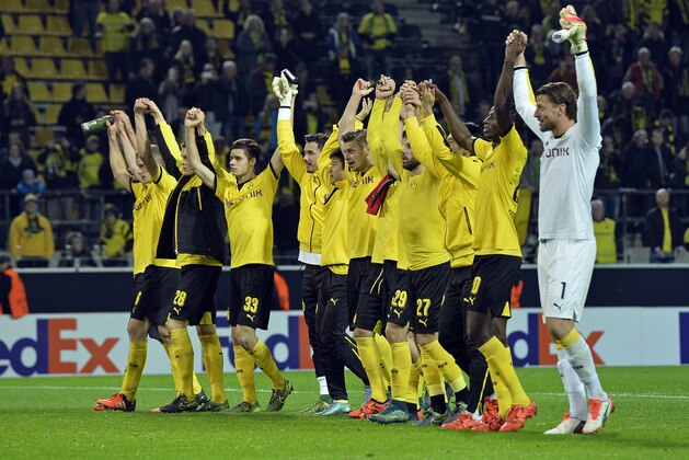 Dortmund's team celebrates with supporters after winning the Europa League group C soccer match between Borussia Dortmund and Qabala FC in Dortmund, Germany, Thursday, Nov. 5, 2015. Dortmund defeated Qabala with 4-0. (AP Photo/Martin Meissner) Dortmund's team celebrates with supporters after winning the Europa League group C soccer match between Borussia Dortmund and Qabala FC in Dortmund, Germany, Thursday, Nov. 5, 2015. Dortmund defeated Qabala with 4-0. (AP Photo/Martin Meissner)