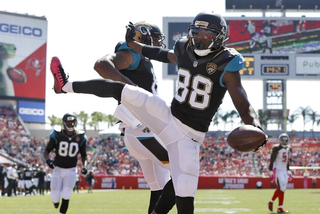Jacksonville Jaguars wide receiver Allen Hurns (88) celebrates his touchdown reception with tight end Marcedes Lewis (89) during the second quarter of an NFL football game against the Tampa Bay Buccaneers Sunday, Oct. 11, 2015, in Tampa, Fla. (AP Photo/Brian Blanco)