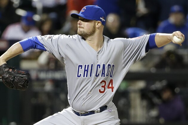 Chicago Cubs pitcher Jon Lester throws during the first inning of Game 1 of the National League baseball championship series against the New York Mets Saturday, Oct. 17, 2015, in New York. (AP Photo/David J. Phillip)