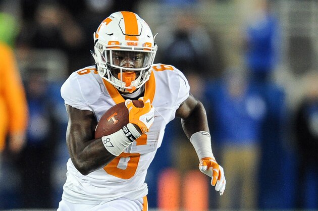 Oct 31, 2015; Lexington, KY, USA; Tennessee Volunteers running back Alvin Kamara (6) breaks a tackle against the Kentucky Wildcats. Mandatory Credit: Bryan Lynn-USA TODAY Sports