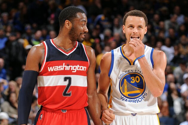 OAKLAND, CA - MARCH 23: John Wall #2 of the Washington Wizards and Stephen Curry #30 of the Golden State Warriors during a game on March 23, 2015 at Oracle Arena in Oakland, California. NOTE TO USER: User expressly acknowledges and agrees that, by downloading and or using this photograph, user is consenting to the terms and conditions of Getty Images License Agreement. Mandatory Copyright Notice: Copyright 2015 NBAE (Photo by Noah Graham/NBAE via Getty Images)