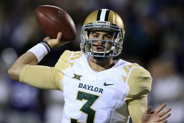 Baylor quarterback Jarrett Stidham (3) passes to a teammate during the first half of an NCAA college football game against Kansas State in Manhattan, Kan., Thursday, Nov. 5, 2015. (AP Photo/Orlin Wagner)