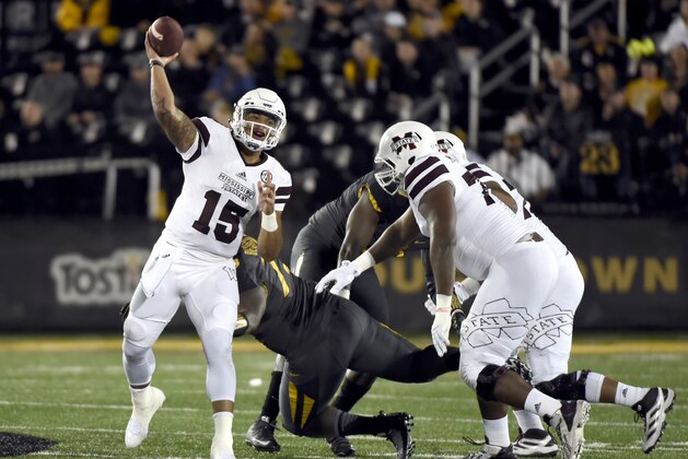Mississippi State quarterback Dak Prescott (15) throws during the first half of an NCAA college football game against Missouri on Thursday, Nov. 5, 2015, in Columbia, Mo. (AP Photo/L.G Patterson)