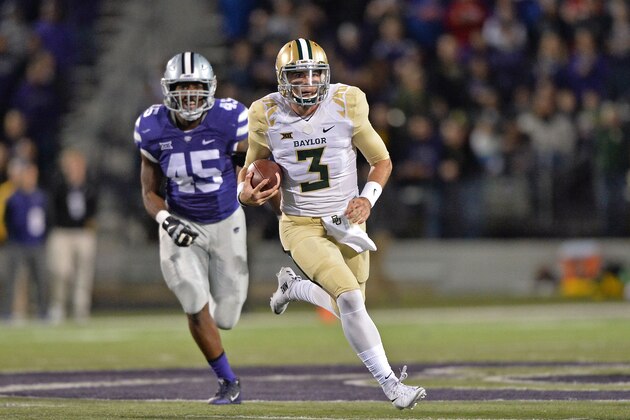 MANHATTAN, KS - NOVEMBER 05:  Quarterback Jarrett Stidham #3 of the Baylor Bears rushes up field past defensive end Marquel Bryant #45 of the Kansas State Wildcats during the first half on November 5, 2015 at Bill Snyder Family Stadium in Manhattan, Kansas.  (Photo by Peter G. Aiken/Getty Images)