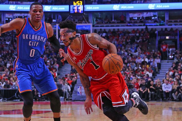 Nov 5, 2015; Chicago, IL, USA; Chicago Bulls guard Derrick Rose (1) dribble the ball around Oklahoma City Thunder guard Russell Westbrook (0) during the second half at the United Center. The Bulls won 104-98. Mandatory Credit: Dennis Wierzbicki-USA TODAY Sports