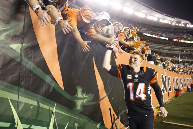 Cincinnati Bengals' Andy Dalton (14) celebrates after an NFL football game against the Cleveland Browns, Thursday, Nov. 5, 2015, in Cincinnati. The Bengals won 31-10. (AP Photo/Gary Landers)