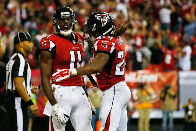 ATLANTA, GA - NOVEMBER 01:  Julio Jones #11 celebrates with  Devonta Freeman #24 of the Atlanta Falcons after scoring a touchdown to put the game into overtime during the second half against the Tampa Bay Buccaneers at the Georgia Dome on November 1, 2015 in Atlanta, Georgia.  (Photo by Kevin C. Cox/Getty Images)
