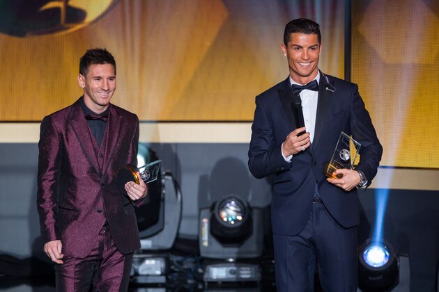 ZURICH, SWITZERLAND - JANUARY 12: FIFA Ballon d'Or nominees Lionel Messi of Argentina and FC Barcelona  (L) and Cristiano Ronaldo of Portugal and Real Madrid smile during the FIFA Ballon d'Or Gala 2014 at the Kongresshaus on January 12, 2015 in Zurich, Switzerland. (Photo by Philipp Schmidli/Getty Images)