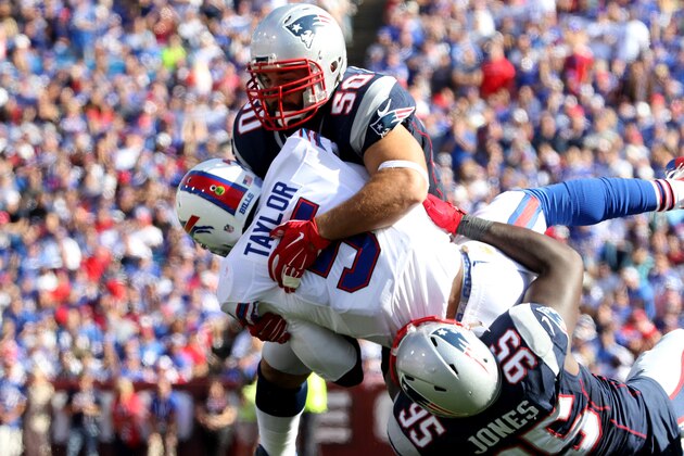 ORCHARD PARK, NY - SEPTEMBER 20:  Chandler Jones #95  and Rob Ninkovich of the New England Patriots  combine to sack Tyrod Taylor #5 of the Buffalo Bills during the first half against the Buffalo Bills  at Ralph Wilson Stadium on September 20, 2015 in Orchard Park, New York. (Photo by Jerome Davis/Getty Images)