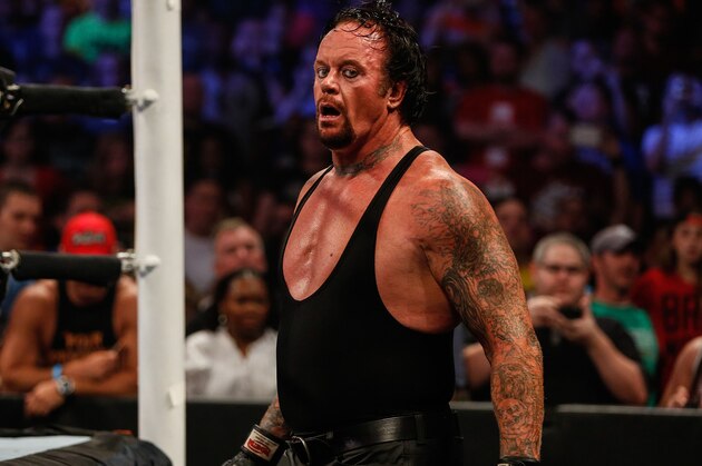 NEW YORK, NY - AUGUST 23: The Undertaker recovers during his fight against Brock Lesner at the WWE SummerSlam 2015 at Barclays Center of Brooklyn on August 23, 2015 in New York City.  (Photo by JP Yim/Getty Images)
