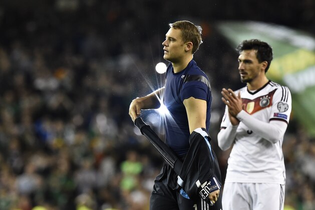 Germany's goalkeeper Manuel Neuer (L) and Germany's defender Mats Hummels walk from the pitch after losing a UEFA Euro 2016 Group D qualifying football match between Germany and Ireland at the Aviva stadium in Dublin on October 8, 2015.  AFP PHOTO / TOBIAS SCHWARZ        (Photo credit should read TOBIAS SCHWARZ/AFP/Getty Images)