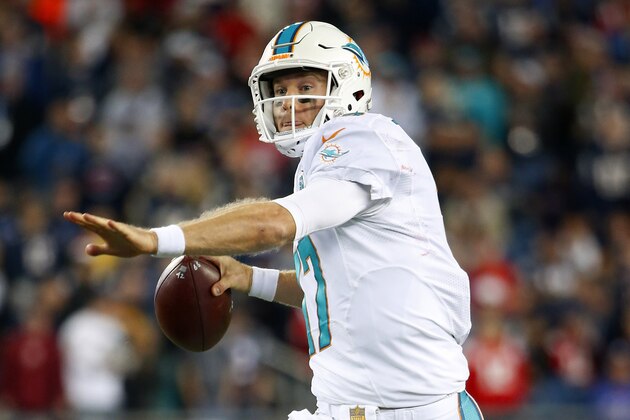 Miami Dolphins quarterback Ryan Tannehill throws against the New England Patriots during a NFL football game at Gillette Stadium in Foxborough, Mass. Thursday, Oct. 29, 2015. (Winslow Townson/AP Images for Panini)