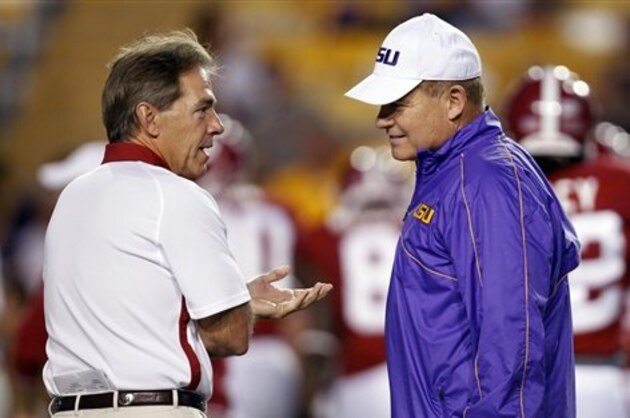Alabama head coach Nick Saban, left, and LSU head coach Les Miles greet each other before their NCAA college football game in Baton Rouge, La., Saturday, Nov. 3, 2012. (AP Photo/Gerald Herbert)