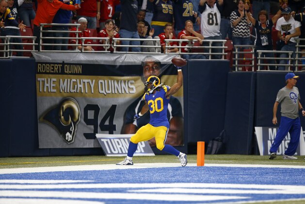St. Louis Rams running back Todd Gurley celebrates after scoring on a 71-yard touchdown run during the second quarter of an NFL football game against the San Francisco 49ers Sunday, Nov. 1, 2015, in St. Louis. (AP Photo/Billy Hurst)