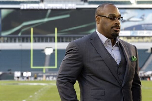 FILE - In this Sept. 19, 2013, file photo, former Philadelphia Eagles quarterback Donovan McNabb pauses during a television interview before an NFL football game against the Kansas City Chiefs, in Philadelphia. McNabb has been arrested again in Arizona on suspicion of driving while under the influence. Police in the Phoenix suburb of Gilbert said Tuesday, July 7, 2015, that McNabb was cited and released from a police facility after being arrested June 28, 2015, following a non-injury collision late that night.  (AP Photo/Julio Cortez, File)