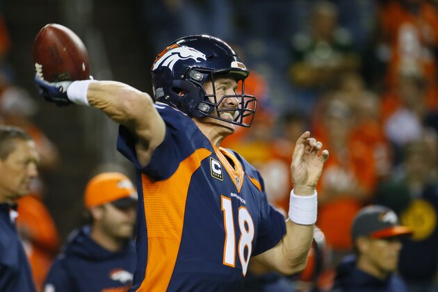 Denver Broncos quarterback Peyton Manning throws prior to an NFL football game against the Green Bay Packers, Sunday, Nov. 1, 2015, in Denver. (AP Photo/Jack Dempsey)