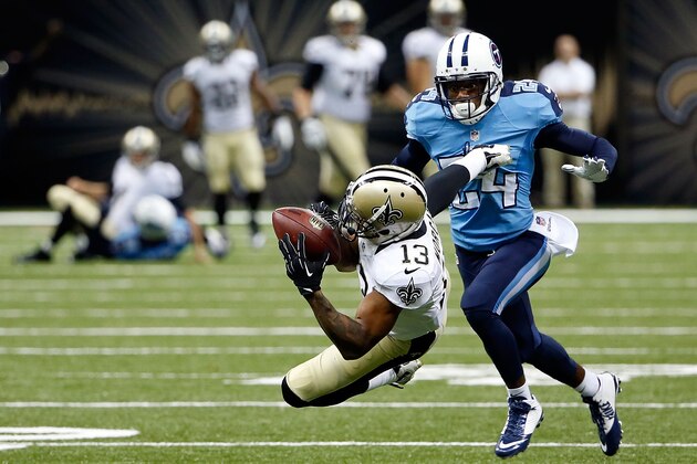 NEW ORLEANS, LA - AUGUST 15:  Joseph Morgan #13 of the New Orleans Saints makes a diving catch in front of Coty Sensabaugh #24 of the Tennessee Titans during a preseason game at the Mercedes-Benz Superdome on August 15, 2014 in New Orleans, Louisiana.  (Photo by Stacy Revere/Getty Images)