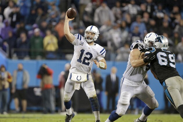 Indianapolis Colts' Andrew Luck (12) makes a pass against the Carolina Panthers' defense in the second half of an NFL football game in Charlotte, N.C., Monday, Nov. 2, 2015. The Panthers won in overtime 29-26. (AP Photo/Bob Leverone)