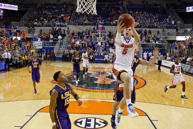 GAINESVILLE, FL - JANUARY 20: Alex Murphy #5 of the Florida Gators drives to the basket during the second half of the game against the LSU Tigers at Stephen C. O'Connell Center on January 20, 2015 in Gainesville, Florida.  (Photo by Rob Foldy/Getty Images)