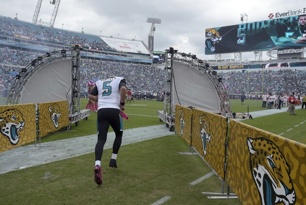 Jacksonville Jaguars quarterback Blake Bortles (5) runs onto the field during player introductions before an NFL football game against the Houston Texans in Jacksonville, Fla., Sunday, Oct. 18, 2015. (AP Photo/Phelan M. Ebenhack)
