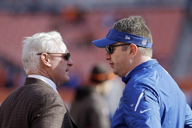 Cleveland Browns owner Jimmy Haslam, left, talks with former Browns coach Rob Chudzinski, now an Indianapolis Colts special assistant, before an NFL football game Sunday, Dec. 7, 2014, in Cleveland. (AP Photo/Tony Dejak)