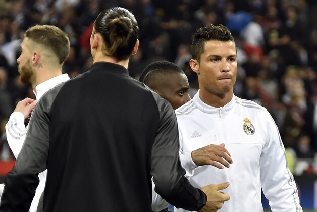 Paris Saint-Germain's Swedish forward Zlatan Ibrahimovic (L) greets Real Madrid's Portuguese forward Cristiano Ronaldo before the UEFA Champions League group stage football match Real Madrid CF vs Paris Saint-Germain (PSG) at the Santiago Bernabeu stadium in Madrid on November 3, 2015.   AFP PHOTO / GERARD JULIEN        (Photo credit should read GERARD JULIEN/AFP/Getty Images)
