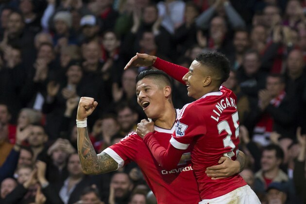 Manchester United's Jesse Lingard, right, celebrates with teammate Marcos Rojo after scoring during the English Premier League soccer match between Manchester United and West Bromwich Albion at Old Trafford Stadium, Manchester, England, Saturday, Nov. 7, 2015. (AP Photo/Jon Super)