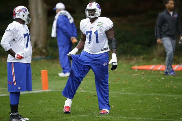 Buffalo Bills Cameroonian-born offensive tackle Cyrus Kouandjio, 71, takes part in an NFL training session at the Grove Hotel in Chandler's Cross, England, Thursday, Oct. 22, 2015. The Buffalo Bills play the Jacksonville Jaguars at Wembley stadium in London on Sunday in a regular season NFL game.  (AP Photo/Matt Dunham)