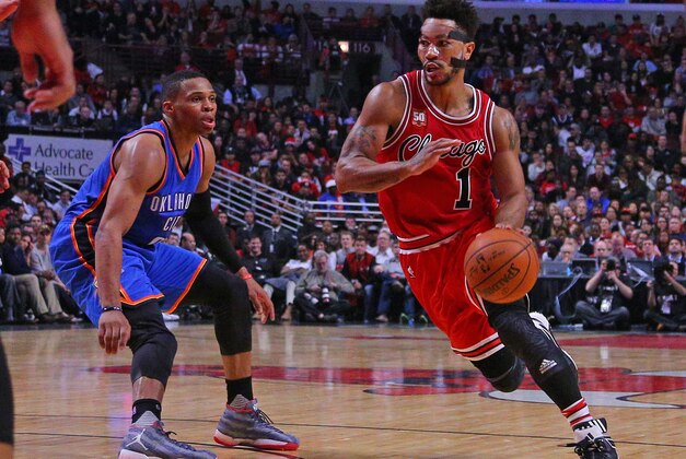 Nov 5, 2015; Chicago, IL, USA; Chicago Bulls guard Derrick Rose (1) dribble the ball around Oklahoma City Thunder guard Russell Westbrook (0) during the second half at the United Center. The Bulls won 104-98. Mandatory Credit: Dennis Wierzbicki-USA TODAY Sports