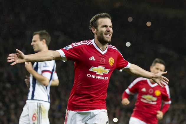 Manchester United's Juan Mata, centre, celebrates after scoring during the English Premier League soccer match between Manchester United and West Bromwich Albion at Old Trafford Stadium, Manchester, England, Saturday, Nov. 7, 2015. (AP Photo/Jon Super)