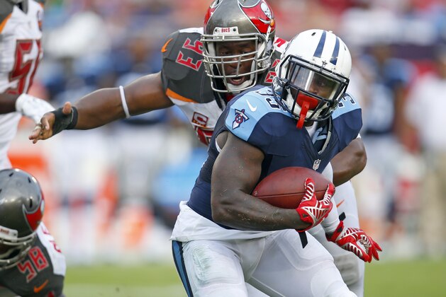 Tennessee Titans running back Terrance West (35) runs the ball as he is chased down by Tampa Bay Buccaneers defensive tackle Gerald McCoy (93) during an NFL football game Sunday, Sept. 13, 2015, in Tampa, Fla. The Titans defeated the Bucs 42-14. (Jeff Haynes/AP Images for Panini)
