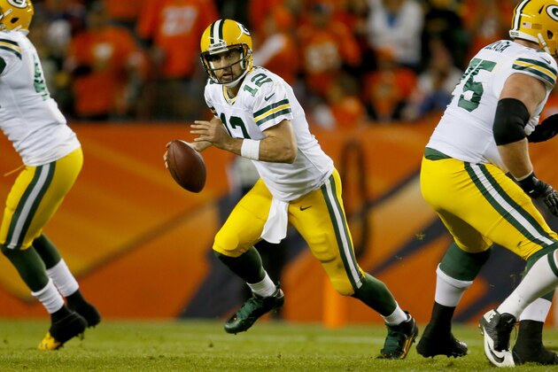 Green Bay Packers quarterback Aaron Rodgers (12) scrambles against the Denver Broncos during the second half of an NFL football game, Sunday, Nov. 1, 2015, in Denver. (AP Photo/Joe Mahoney)