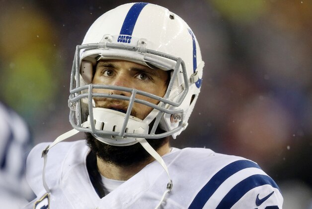 Indianapolis Colts quarterback Andrew Luck reacts after throwing an interception during the second half of the NFL football AFC Championship game against the New England Patriots Sunday, Jan. 18, 2015, in Foxborough, Mass. (AP Photo/Julio Cortez)