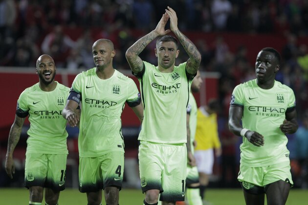 Manchester City team players applaud the fans at the end of the Group D Champions League soccer match between Sevilla and Manchester City at the Ramon Sanchez-Pizjuan stadium in Seville, Spain, Tuesday Nov. 3, 2015. Manchester City won the match 3-1. (AP Photo/Miguel Angel Morenatti)