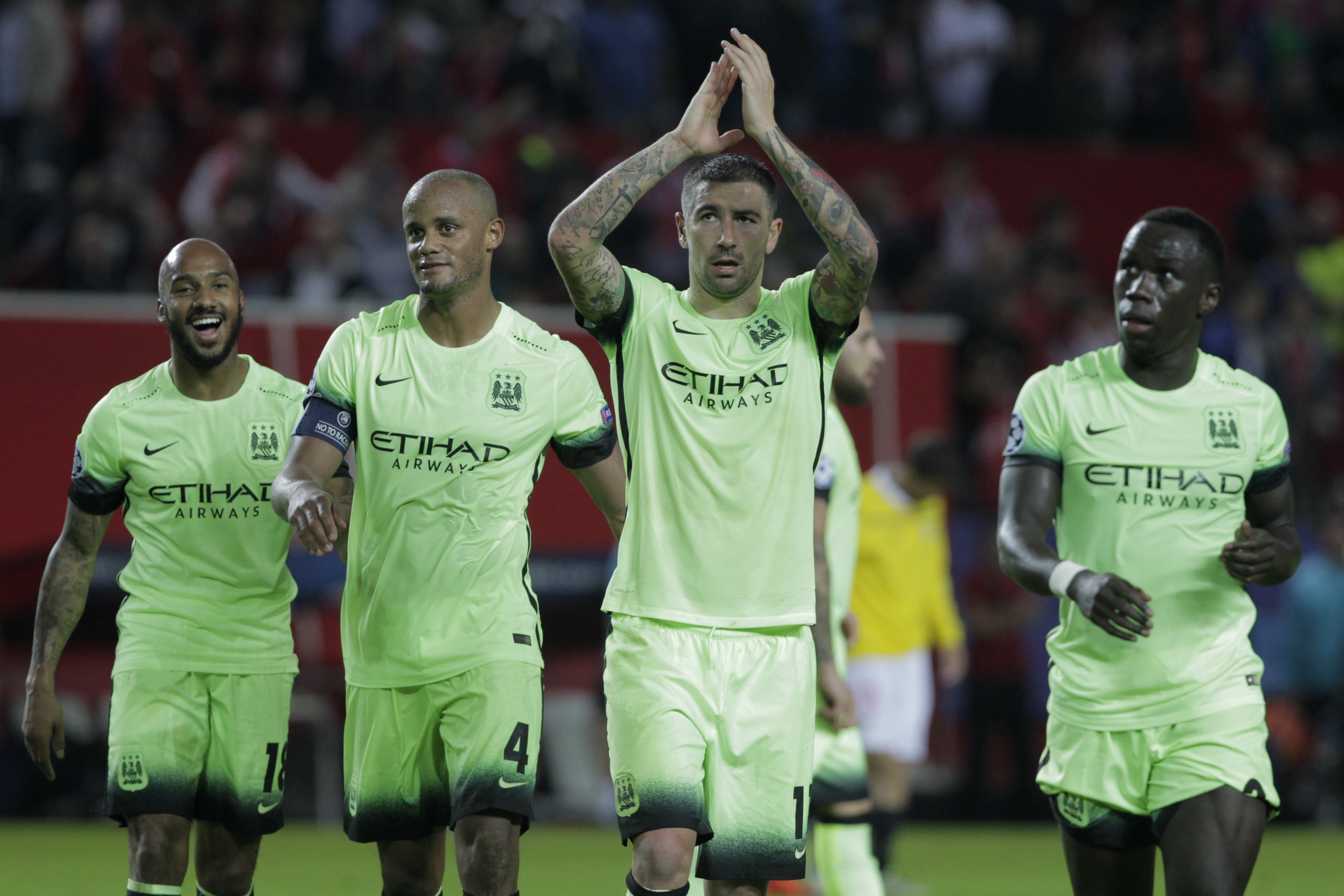Manchester City team players applaud the fans at the end of the Group D Champions League soccer match between Sevilla and Manchester City at the Ramon Sanchez-Pizjuan stadium in Seville, Spain, Tuesday Nov. 3, 2015. Manchester City won the match 3-1. (AP Photo/Miguel Angel Morenatti)
